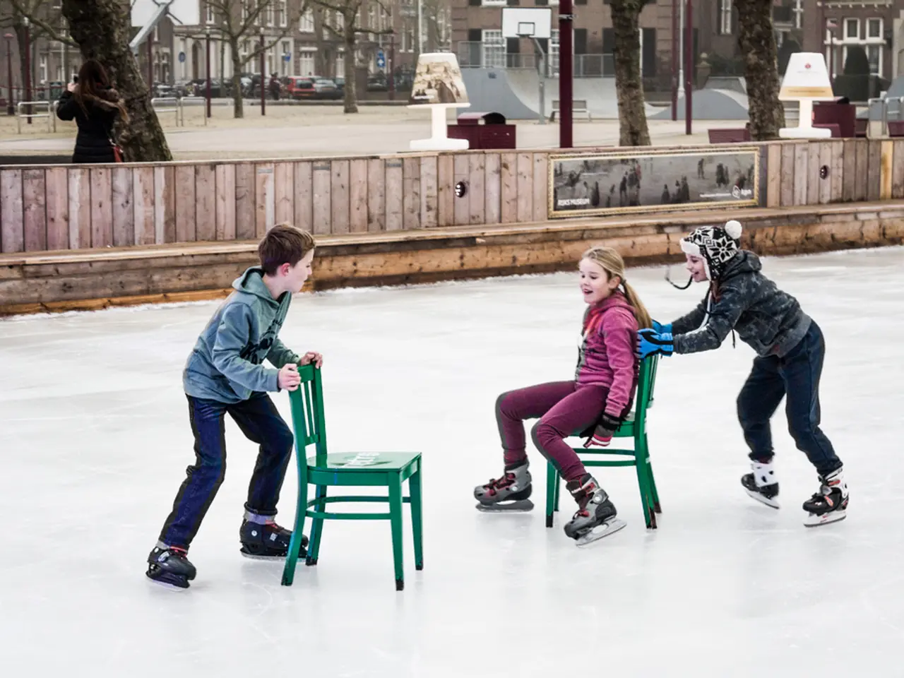 The picture is taken in a local playground in the locality of houses. in the foreground of the...