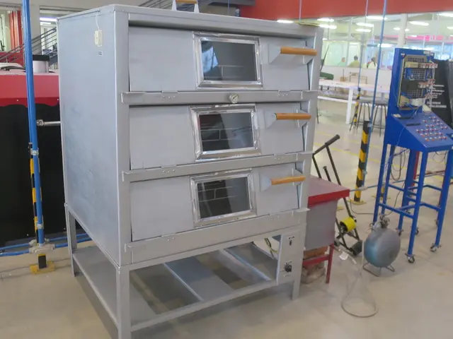 In the image there are many electrical equipment and metal racks in the front, it seems to be a...